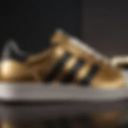 Close-up view of the Adidas Superstar gold shoes showcasing unique design elements.