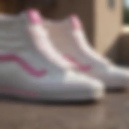 Close-up view of white high top Vans with pink stripe showcasing the texture and design details