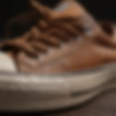 Close-up of brown Converse low tops showcasing design details