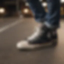 A close-up view of Chuck Taylor All Star shoes on a skateboard