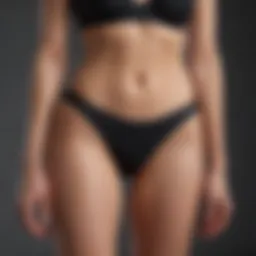 Elegant black high cut bikini bottom showcased against a minimalist background.