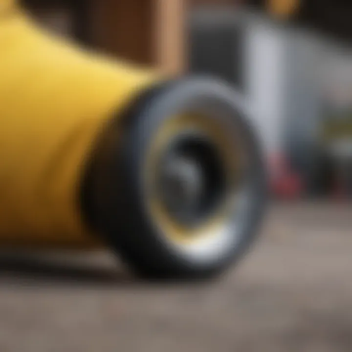 Close-up of a black and yellow shirt with skateboard wheels in the background