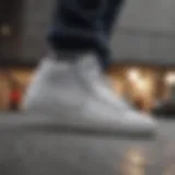 Minimalistic grey and white Nike Blazers with skateboard in the background