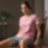 Elegant pink tee shirt draped over a vintage chair