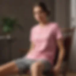 Elegant pink tee shirt draped over a vintage chair