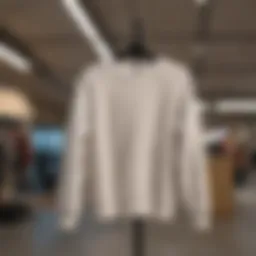 Elegant White Sweatshirt Hanging on Display