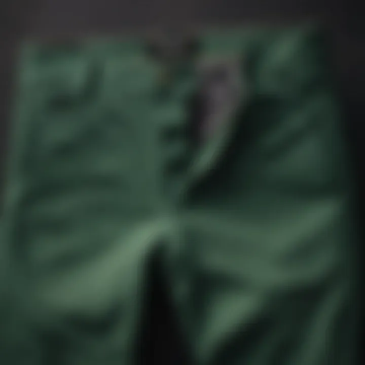 Elegant green chino pants folded neatly