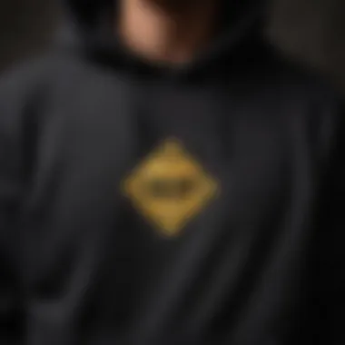 Chic Patchwork Detail on HUF Hoodie Minimalistic Black HUF Hoodie with Unique Patch Design