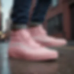 Light pink hightop Vans showcased against a vibrant urban backdrop