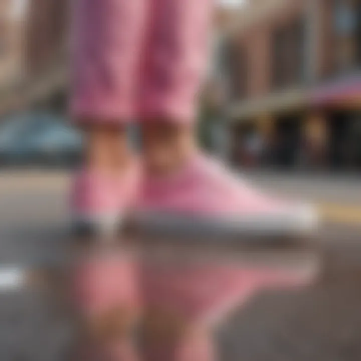 A skateboarder wearing Pink Lemonade Vans Slip-Ons in an urban setting