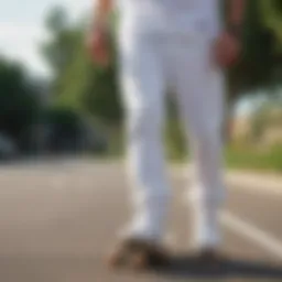 White jogger sweatpants in motion on a skateboard