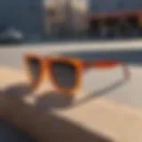 Stylish square gradient sunglasses resting on a skateboard