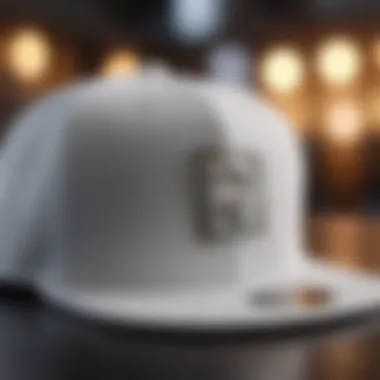 Close-up of an all white snapback showcasing its design details.