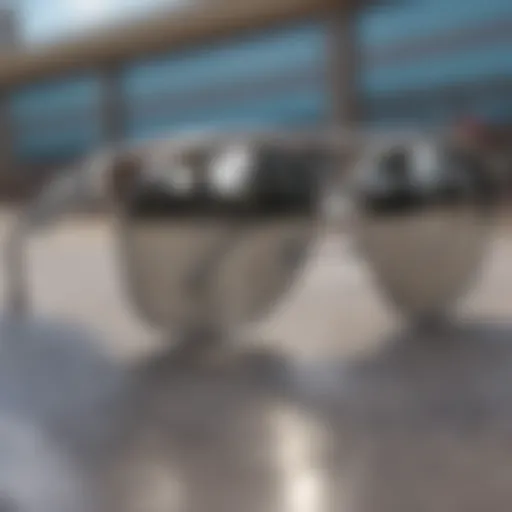 Close-up of silver sunglasses reflecting a skate park