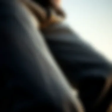 Close-up of the texture and fit of thin black jeans