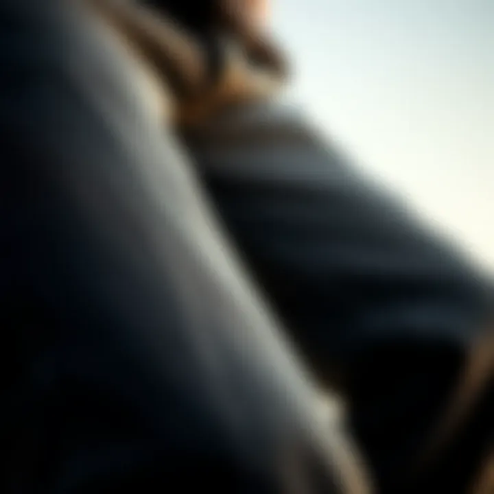 Close-up of the texture and fit of thin black jeans