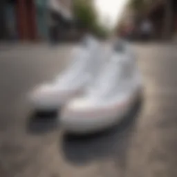Iconic White Converse Sneakers on City Sidewalk